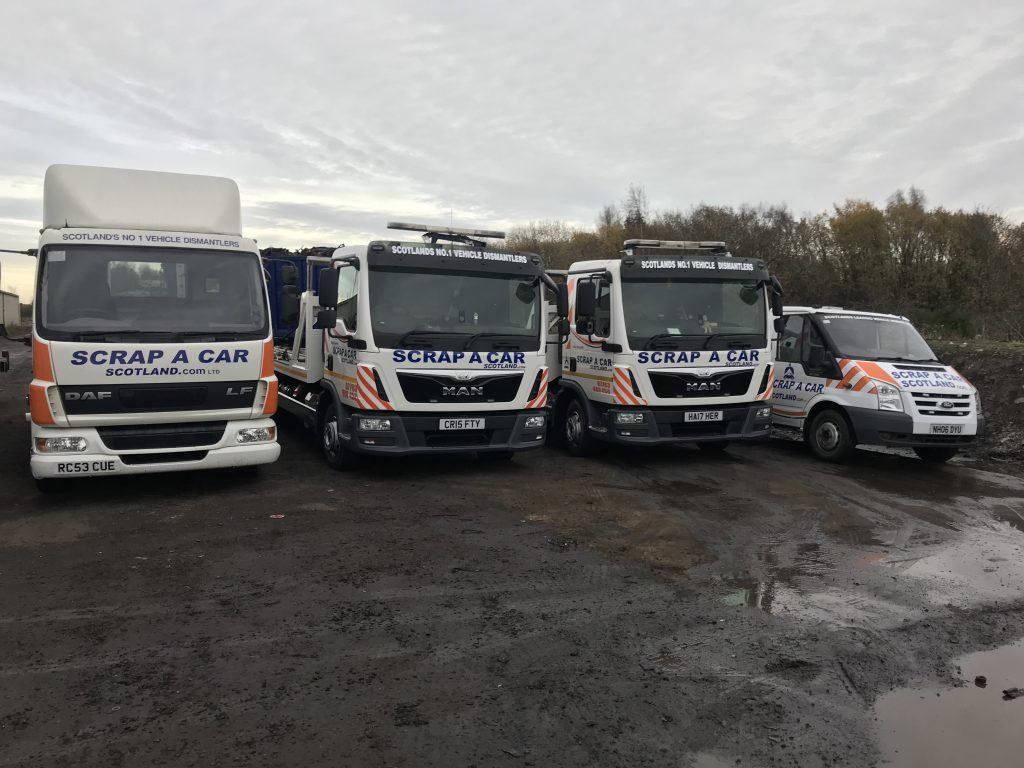 Recovery trucks lined up before a day of scrap car collections covering Grangemouth