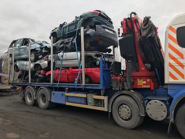 End-of-life vehicles stacked at the depot ready for depollution and steel recycling