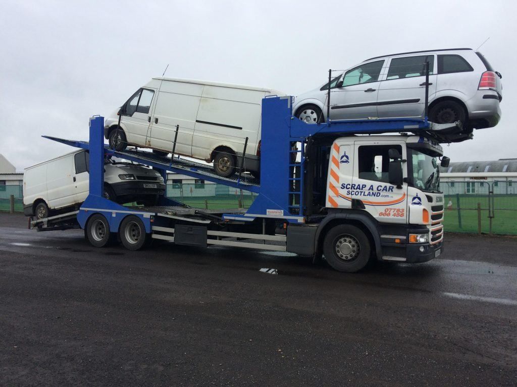 Multi-car transporter and collection vans used for scrap vehicle pickups - failed your mot? your options and when scrapping wins